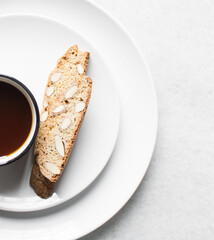 almond biscotti on a white plate, almond cantucci cookies on a white plate, flatlay of biscotti cookies or twice baked cookies