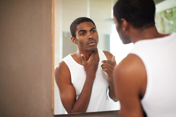 Bathroom, face and black man grooming for skincare or self care with treatment for guy. African...