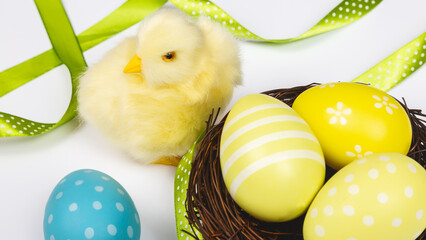 Colored Easter eggs with little chicken. Easter card