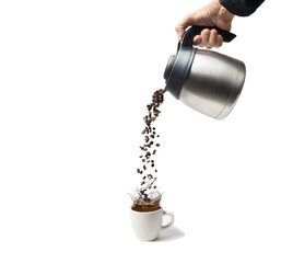 Coffee pot pouring coffee beans into a coffee cup on white background.