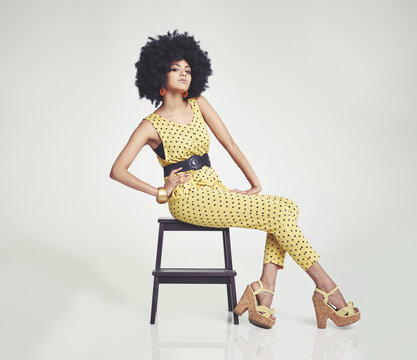 Fashion, retro and portrait of black woman in studio for funky, cool and vintage style. Culture, casual and stylish with face of female person on white background for trendy, clothes and afro