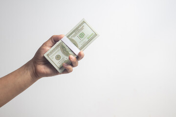 Male hand holding money on white background