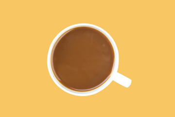 A cup of ground coffee isolated on a orange background. top view.