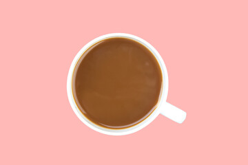A cup of ground coffee isolated on a pink background. top view.