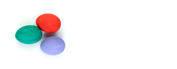 Happy Easter card. Colorful shiny easter eggs on isolated white background. Copy space for text. Banner