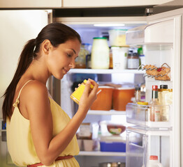 Fridge, cooking and woman with sauce in kitchen checking nutrition label for preparing meal. Food,...