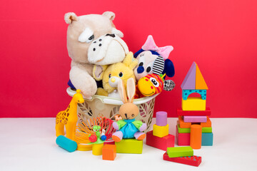 Collection of colorful toys on red background. Kids toys.
