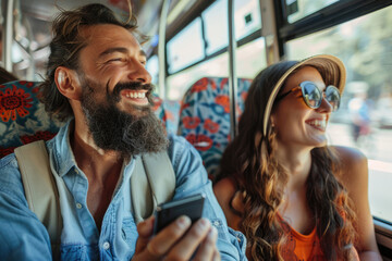 a happy couple using their phones on the bus - obrazy, fototapety, plakaty