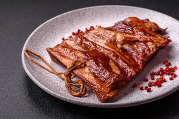 Delicious smoked or grilled ribs with olives, spices and herbs