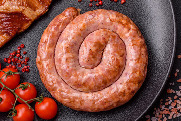 Delicious grilled sausage in the form of a ring with salt, spices and herbs