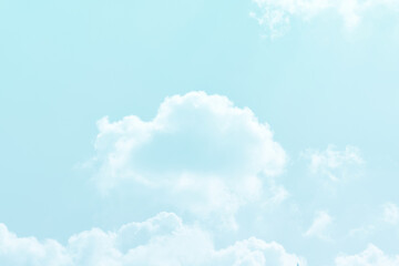 Blue pastel sky with white fluffy cloud. Cumulus clouds background. Cloudscape morning sky. The concepts of freedom of life, never give up and positive though energy.	