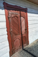 Old wooden door of a wooden house - 749400109
