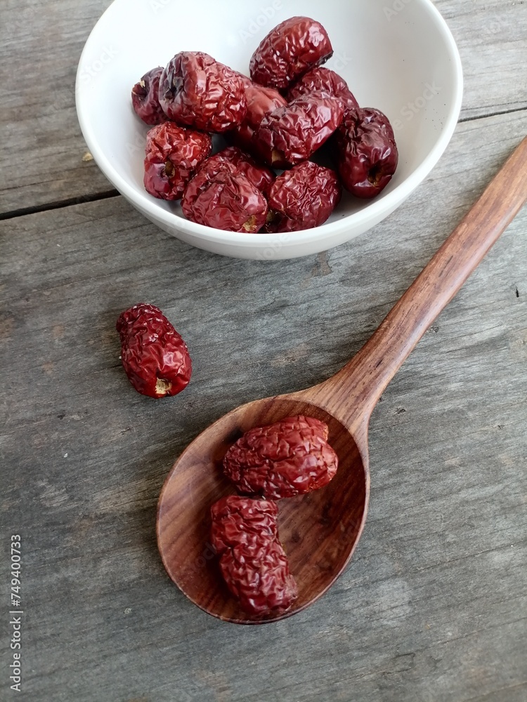 Wall mural dried jujube fruit on wood background