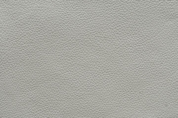 High-resolution image of white leather with a detailed pebbled texture, ideal for backgrounds in luxury design.