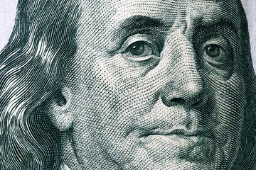 Benjamin Franklin's face on a hundred dollar bill. United States national currency banknote fragment. Benjamin Franklin portrait - obrazy, fototapety, plakaty