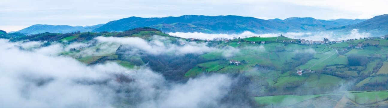 Aerial drone view of the winter landscape around the town of Gainza and Amezqueta and the Txindoki Mountain. Aralar Mountain Range. Goierri region. Gipuzkoa. Basque Country. Spain. Europe