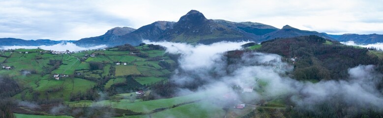 Aerial drone view of the winter landscape around the town of Gainza and Amezqueta and the Txindoki...