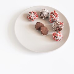 Handmade pralines in coconut and strawberry shell
