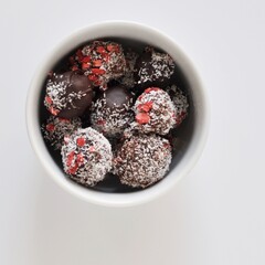 Handmade pralines in coconut and strawberry shell