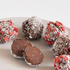 Handmade pralines in coconut and strawberry shell