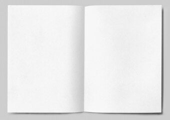Sheet of white paper with detailed edges folded in half isolated on gray