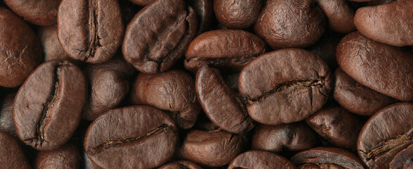 Roasted coffee beans background close-up