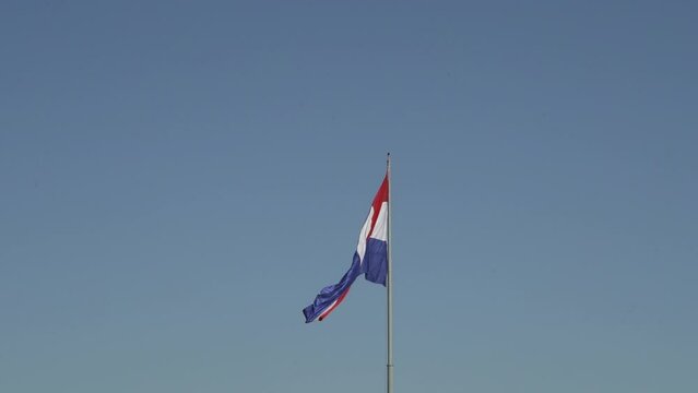 National flag of Paraguay waving in the wind at Cerro Cora national park.