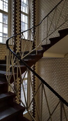 Interior of modern building lobby with spiral staircase