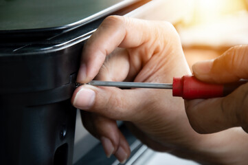 Screwdriver tightens the screws. repair tools Mechanic or engineer tools