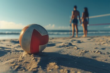 Summertime beach scene, water droplets hanging from a suspended volleyball.