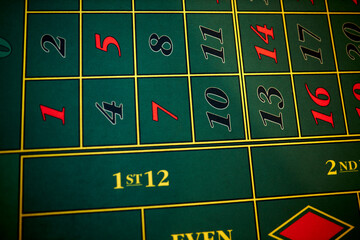 Green casino table. Green roulette Table. Roulette table in a luxury casino. Craps table with green...
