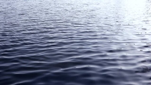 Wavy surface of dark blue water