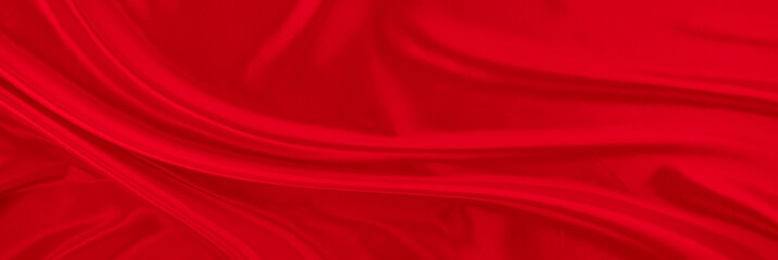 Black gray satin dark fabric texture luxurious shiny that is abstract silk cloth panorama background with patterns soft waves blur beautiful.