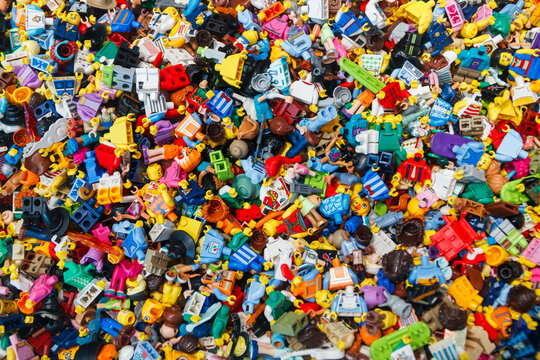 Billund, Denmark - 17 June 2023: Multi-colored plastic Lego mini figure background.