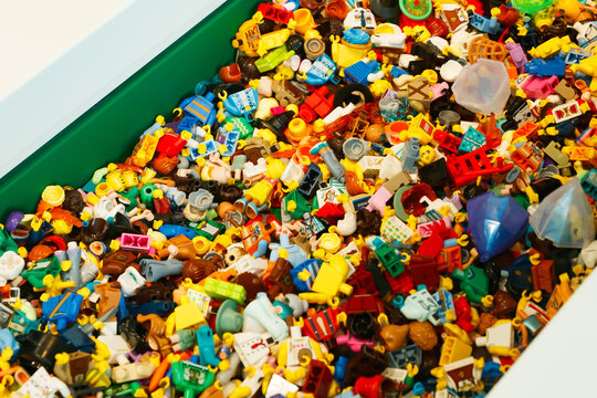 Billund, Denmark - 17 June 2023: Multi-colored plastic Lego mini figure background.