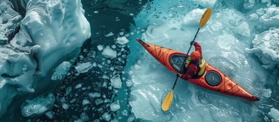 A person in a kayak navigating through icy waters surrounded by a glacial backdrop.