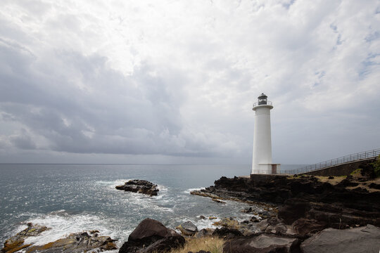 Le Phare du Vieux-Fort, white lighthouse on a cliff. Dramatic clouds overlooking the sea. Pure Caribbean on Guadeloupe, French Antilles, France