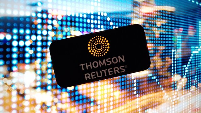 Konskie, Poland - March 02, 2024: Thomson Reuters company logo displayed on mobile phone screen