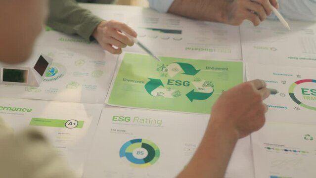 Close-Up of Team Analyzing ESG Sustainability Metrics.
