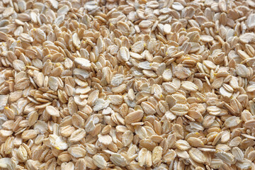 Close up photo of rye flakes, selective focus, food background.
