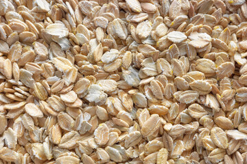 Close up photo of rye flakes, selective focus, food background.