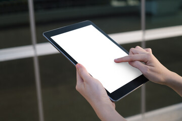 close up side view, woman hands multitasking using tablet, laptop and cellphone connecting wifi. Online global business, shopping or communication technology.  © Bordinthorn