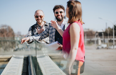 Energetic young professionals collaborate on business strategies outdoors in a bustling urban cityscape, showing teamwork and engagement.