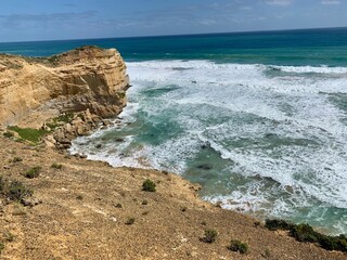 ocean waves crashing on rocks in australia
