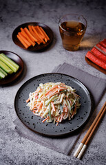 Japanese kani salad with fresh vegetables and crab sticks