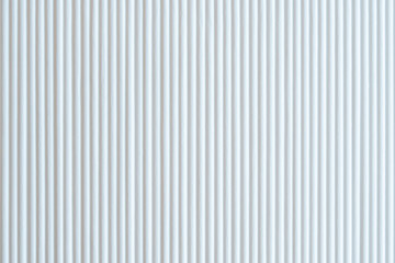 White wooden wall showcasing repetitive lines pattern and industrial texture background for modern...
