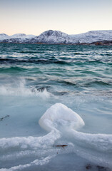 Frozen sea with arrowhead ice formation, Sommaroy near Tromso, northern Norway