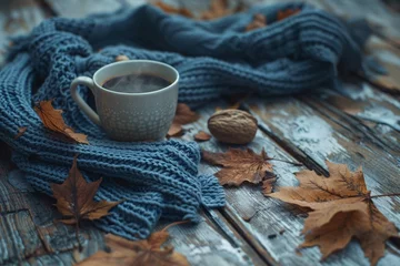 Fototapeten Autumn fall leaves hot steaming cup of cof © Abdul