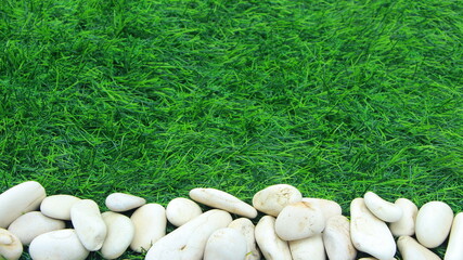 Natural stone with texture, green grass, background