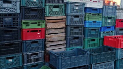Empty Wooden and Plastic Crates for Vegetables Stacked at Closed Market Stand